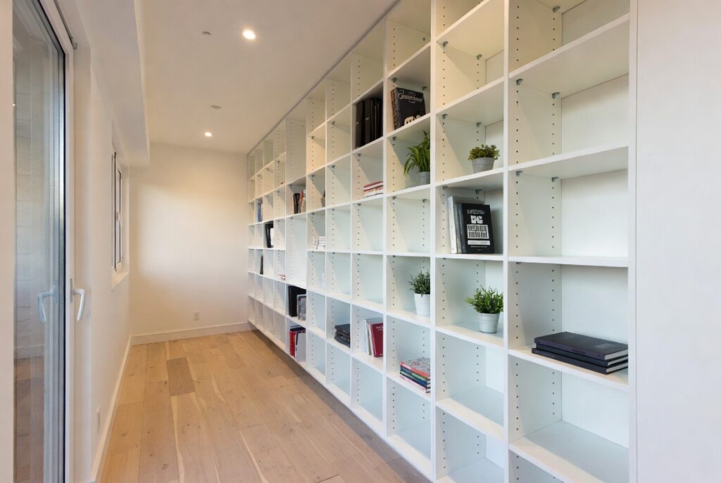 Vertical Storage Walls (Go Up, Not Out)
